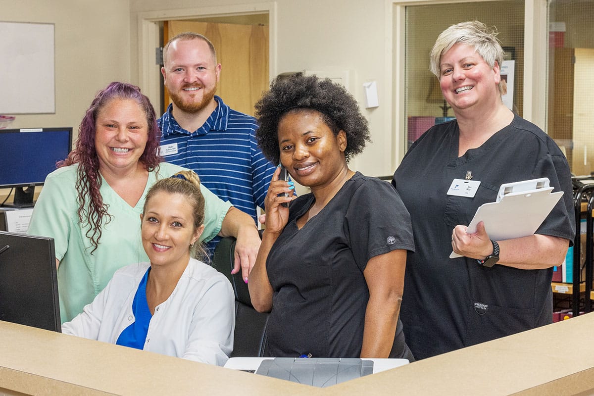 A group of nurses at the Nurse's station at the Piedmont Post Acute facility
