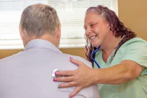 A nurse with a resident at the Piedmont Post Acute facility