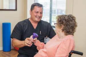 A Rehab therapist in the Rehab gym at the Piedmont Post Acute facility