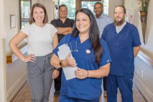 A group of nurses in the hallway at the Piedmont Post Acute facility